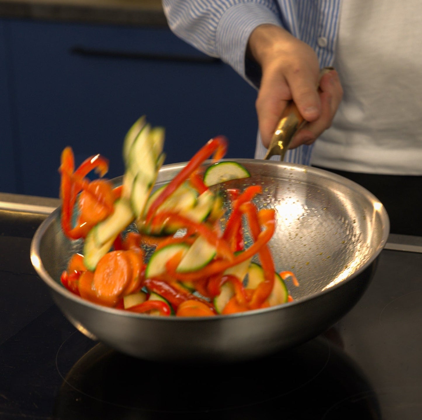 Titanium wok in motion